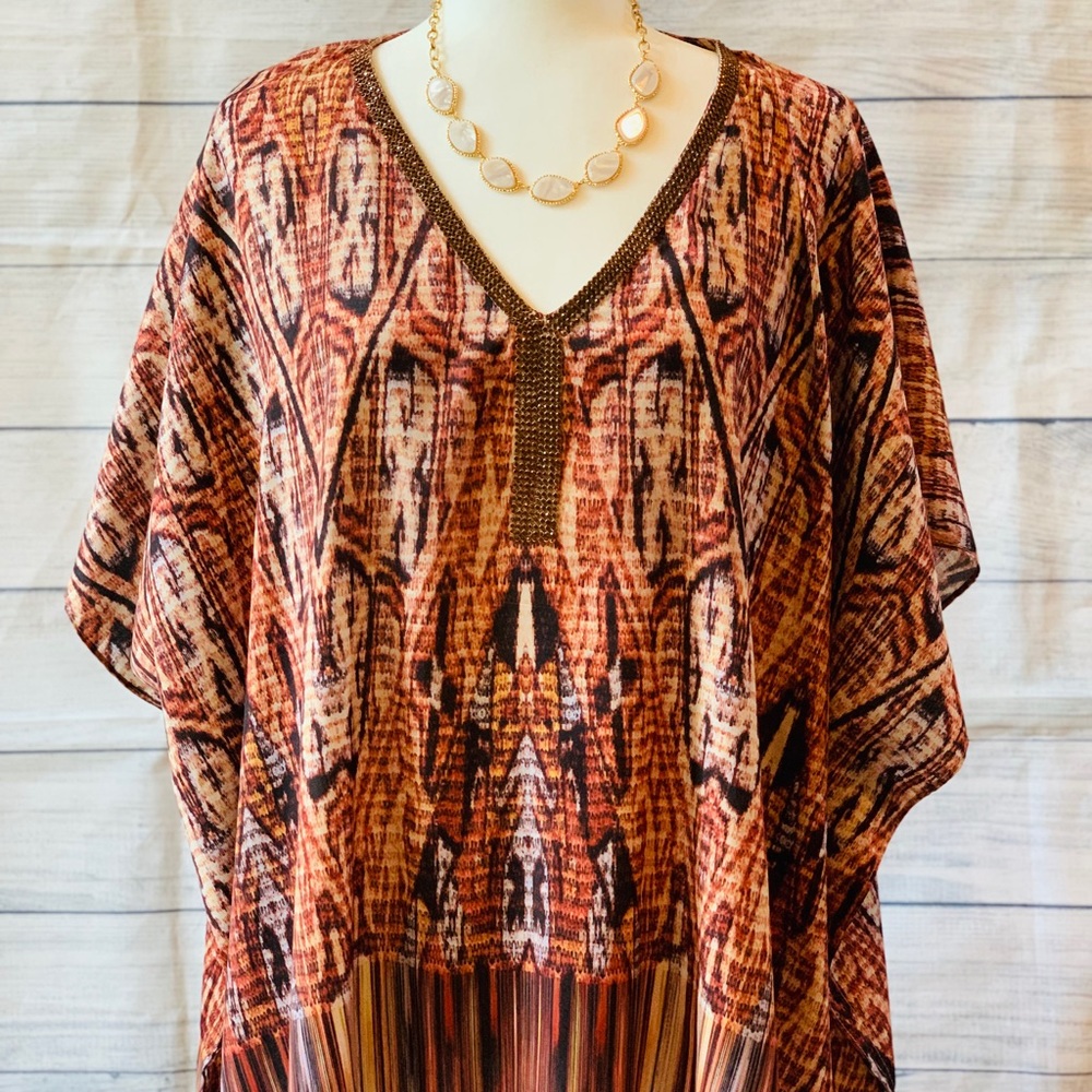 Chico’s poncho size s\m it’s oversized.